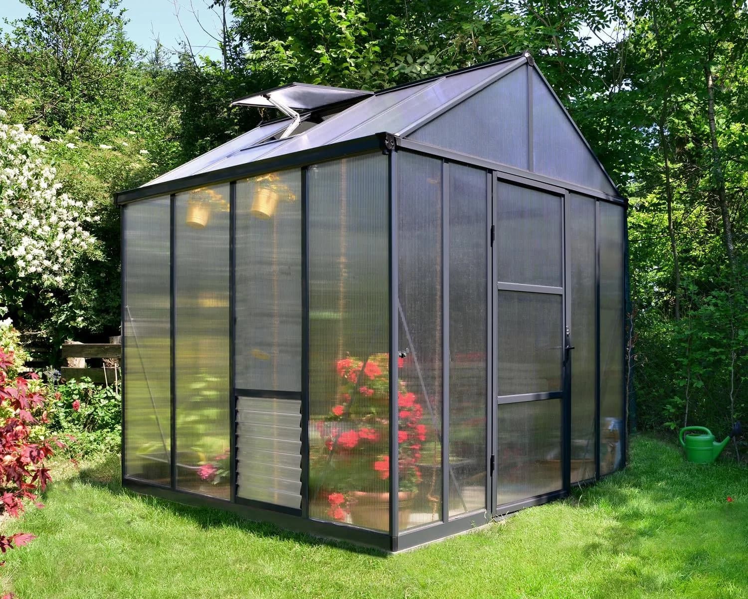 Canopia Glory 8x8 premium greenhouse with 10mm twin-wall polycarbonate panels in a garden